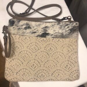 MYRA BAG cream colored woven, leather, and soft fur/hair crossbody.